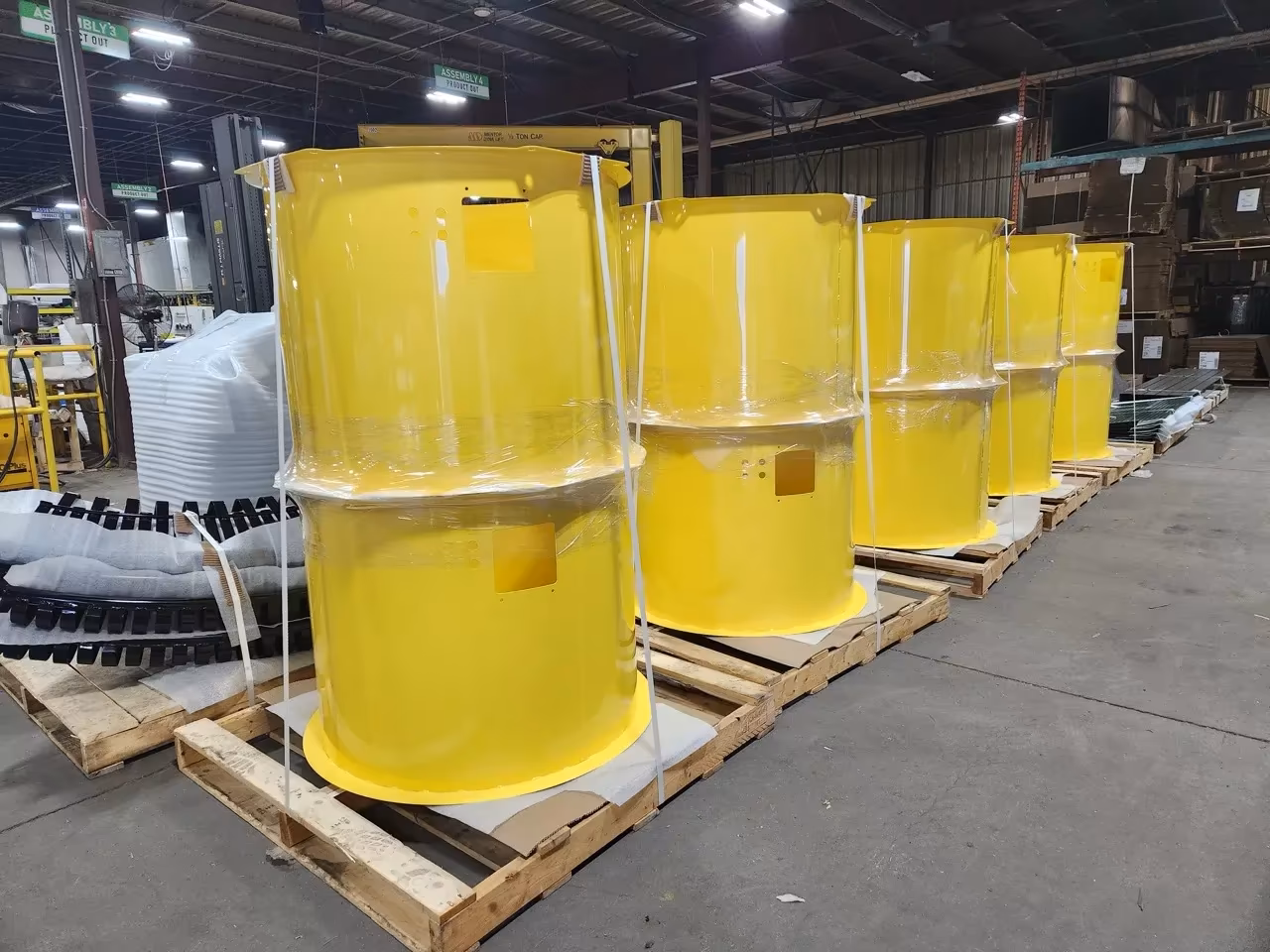 Large yellow powder-coated custom components for industrial air purification system manufactured at JGW Machine